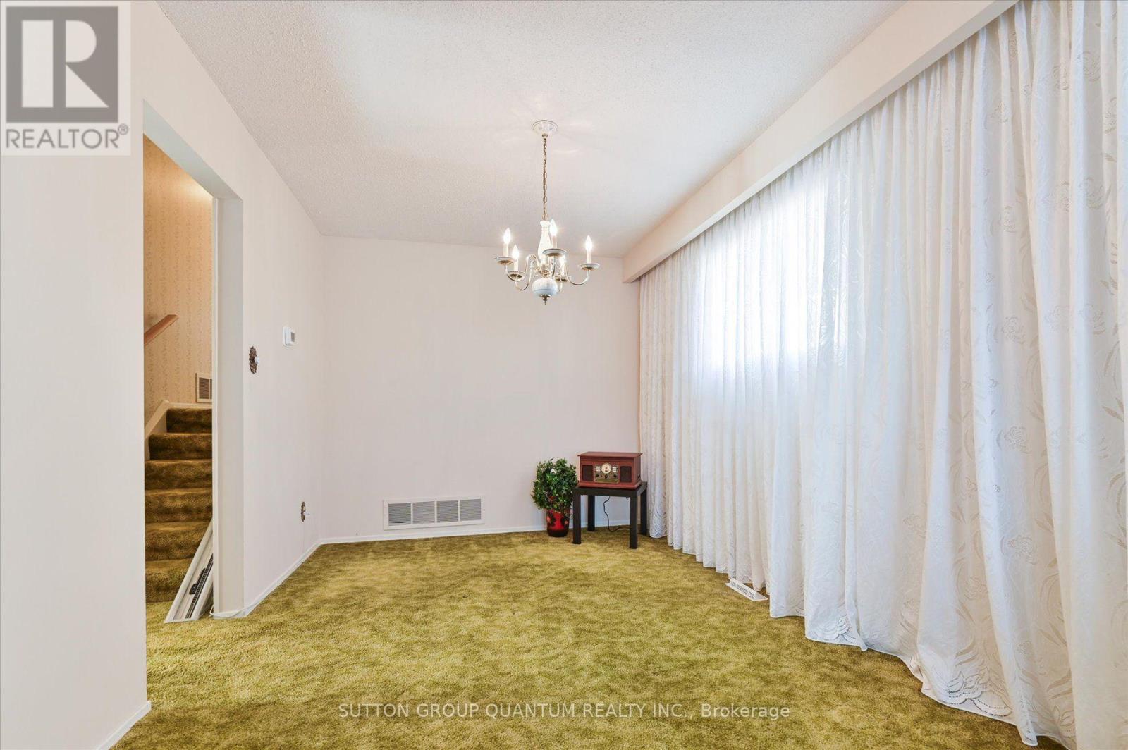 Dining room and stairs to the upper level — 3661 Keenan Crescent